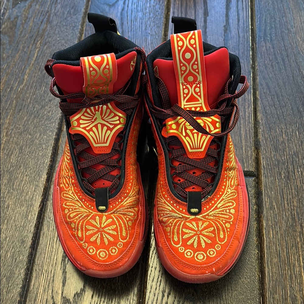 Nike Men’s Jordan 36
Luka Doncic El Matador Red and Gold Sneakers